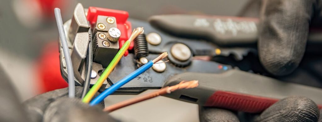 An electrician working ons ome wires.