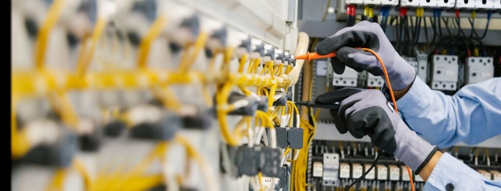 An industrial electrician at work. 